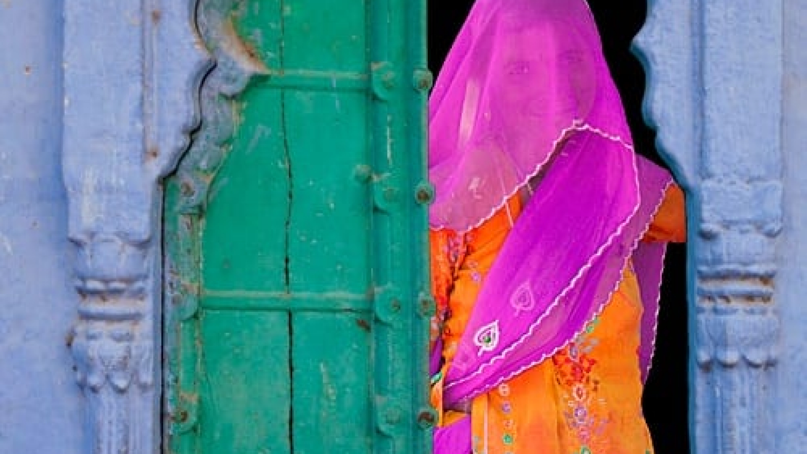 veiled-woman-in-a-window-jodhpur-rajasthan-india